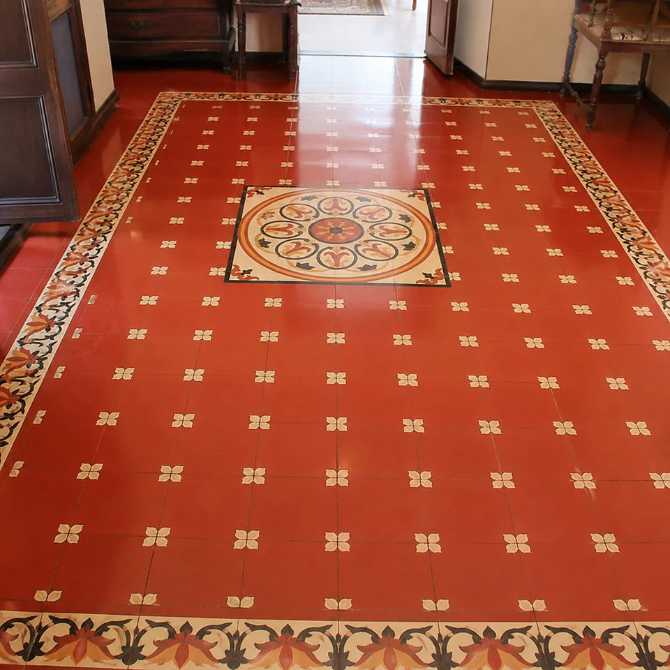 Red bordered Athangudi floor representing Courtyard Signatures
