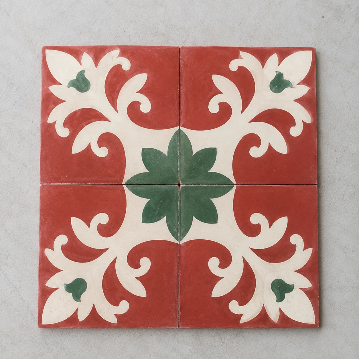 A close view of a four-tile Athangudi floral medallion